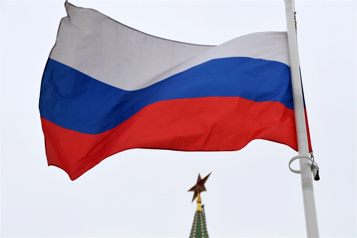 <i>Kirill Kudryavtsev/AFP/Getty Images</i><br/>A Russian flag flies in front of a ruby star atop one of the Kremlin's towers in downtown Moscow.