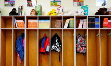 First-grade students hang up their backpacks at a public elementary school in Cincinnati on August 17.