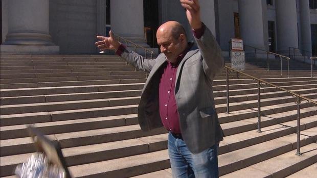 <i>KCNC</i><br/>Jon Caldara dumped human poop that he found outside his business on the steps of the Denver City and County Building on Monday.