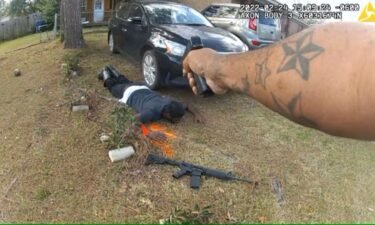 This image from a police officer-worn body camera shows an officer pointing his service weapon at Broderick Tramaine Young after a shootout in Monroeville