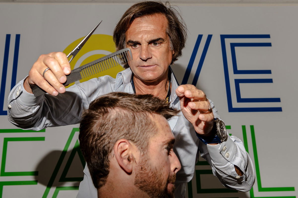 <i>Will Lanzoni/CNN</i><br/>Tennis player Austin Krajicek shows off a fresh haircut at Julien Farel's salon inside of Arthur Ashe stadium in New York on August 30.