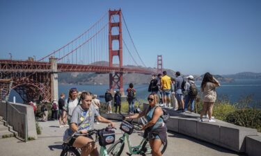 People gather to admire San Francisco's famous Golden Gate Bridge on August 7.