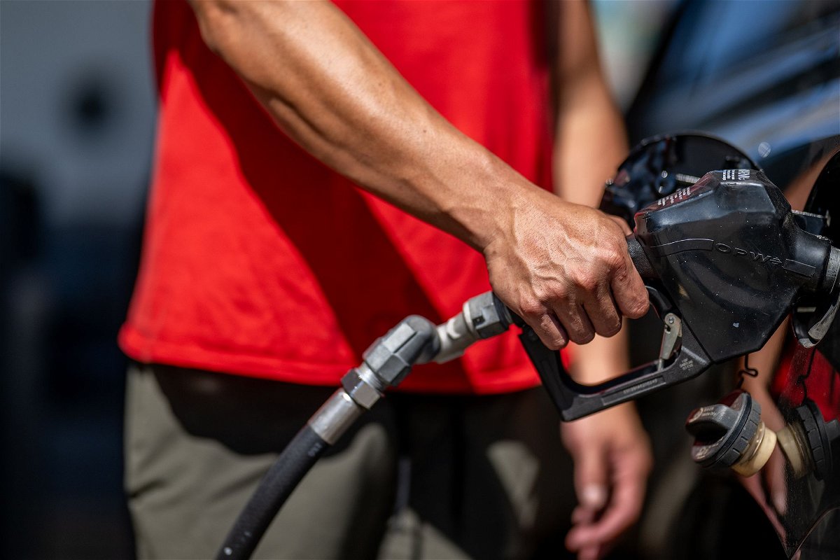 <i>Brandon Bell/Getty Images/FILE</i><br/>A person pumps gas at a Shell gas station on August 3 in Austin