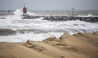 Waves break along the jetty at Rudee Inlet in Virginia Beach