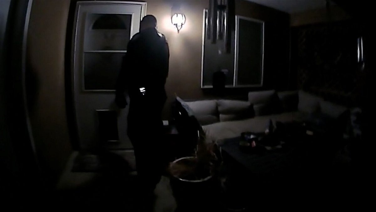 <i>Farmington Police Department</i><br/>Farmington Police Department bodycam footage shows officers standing outside the front door of Robert Dotson's home.