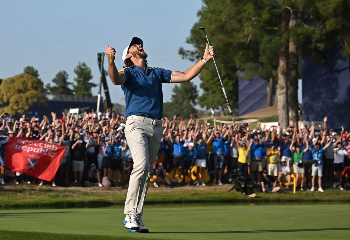 <i>Paul Ellis/AFP/Getty Images</i><br/>Europe's English golfer Tommy Fleetwood celebrates the winning putt on the 17th green during his singles match on Sunday.