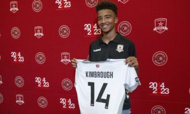 Da'vian Kimbrough holds up his jersey after signing a contract with the Sacramento Republic.