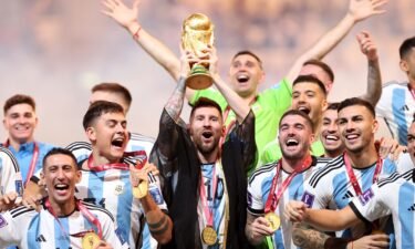 Lionel Messi lifts aloft the World Cup trophy after Argentina won the 2022 edition of the tournament in Qatar.