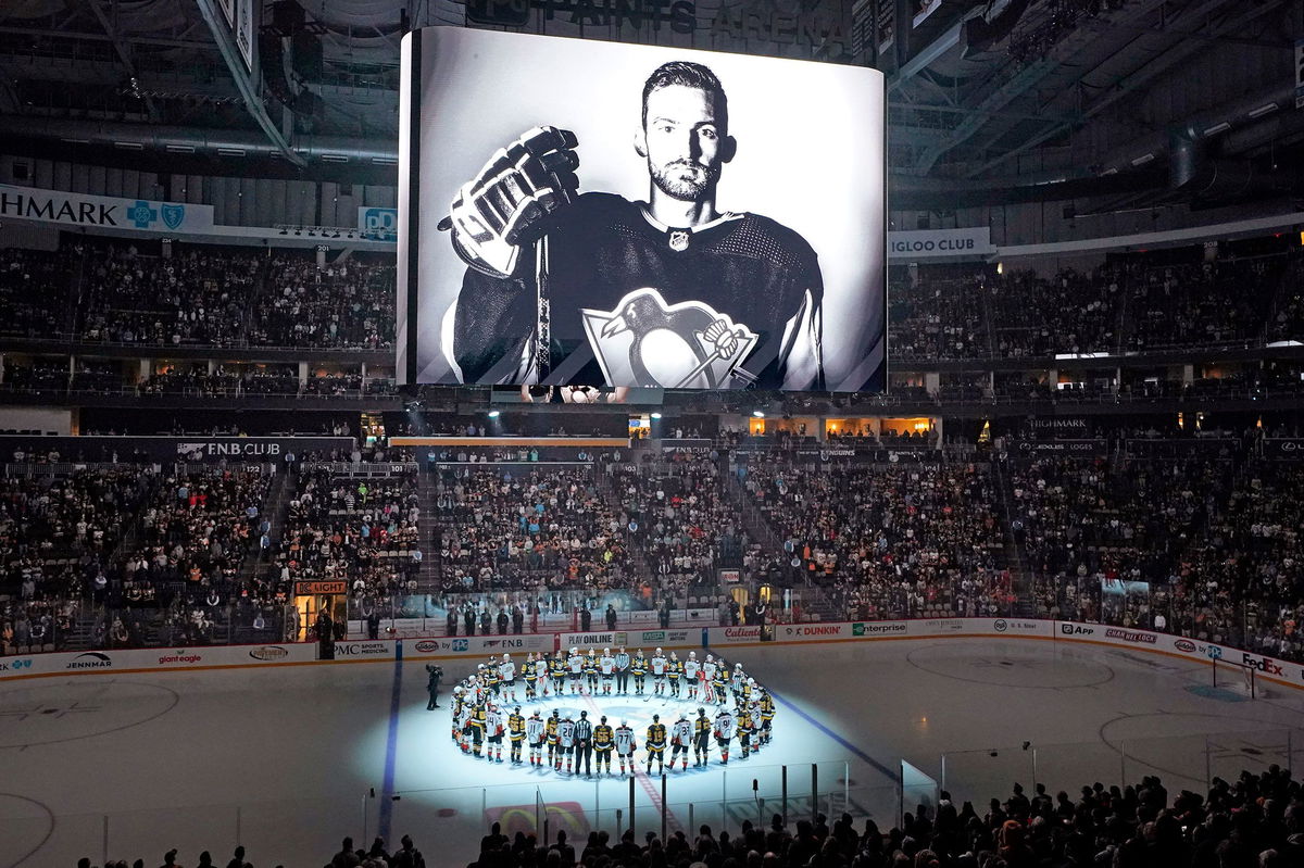 <i>Gene J. Puskar/AP</i><br/>The Pittsburgh Penguins and Anaheim Ducks gather at center ice