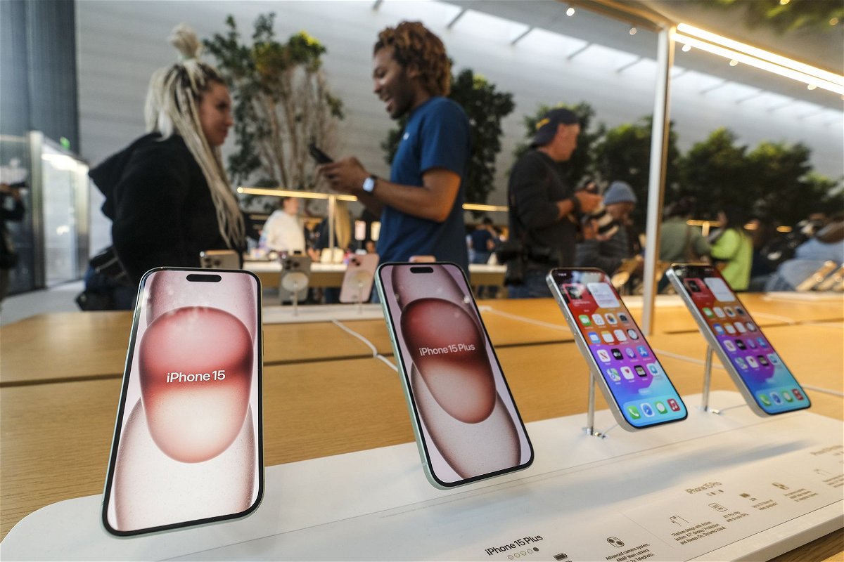 <i>Ringo Chiu/AP</i><br/>Apple's new iPhone 15 models are displayed at the Apple The Grove in Los Angeles on September 22. Apple is working on a software fix following reports that some of its new iPhone 15 models are overheating.
