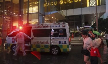 Emergency services arrive after a deadly shooting at a shopping mall in central Bangkok