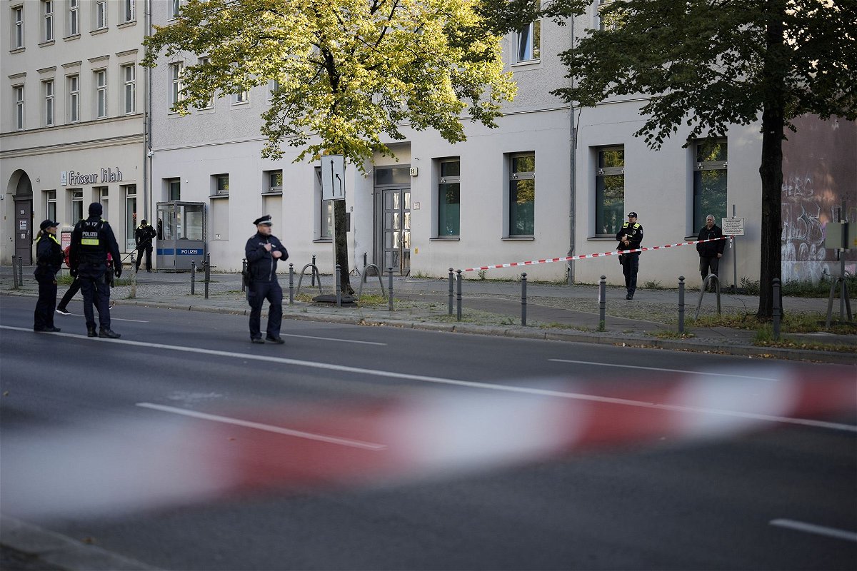 <i>Markus Schreiber/AP</i><br/>A police officer stands guard in front of the building complex.