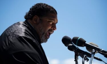 Bishop William J. Barber II seen in 2021 said he tried to use the special chair he brought in the disabled section of the Greenville theater and was told by staff he couldn’t do that.