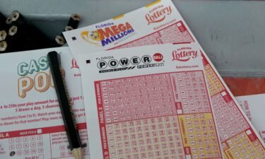 Forms to pick numbers for Powerball are on display in a store in Miami