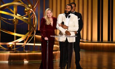 (From left) Christina Applegate and  Anthony Anderson at the 75th Emmy Awards in Los Angeles.