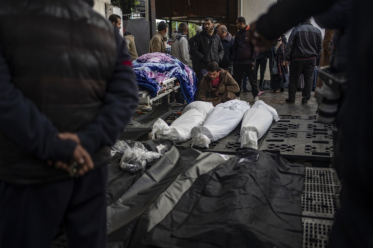 <i>Fatima Shbair/AP</i><br/>Palestinians gather around the bodies of those who were killed in the Israeli ground offensive and bombardment of Khan Younis
