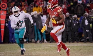 Kansas City Chiefs running back Isiah Pacheco (10) runs the ball as Miami Dolphins linebacker Malik Reed (47) chases in a 2024 AFC wild card game at GEHA Field at Arrowhead Stadium.