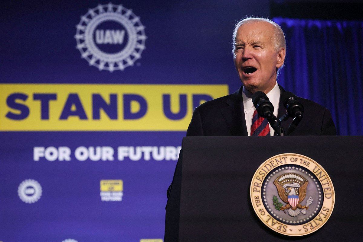 <i>Leah Millis/Reuters</i><br/>President Joe Biden speaks to United Auto Workers members in Washington