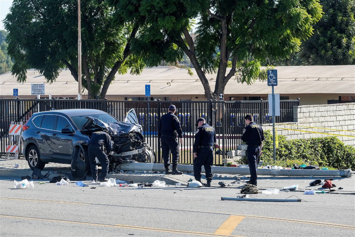 <i>Ringo Chiu/Reuters/FILE</i><br/>Officers investigated the car crash scene on November 16