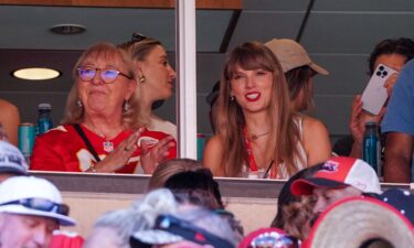 A Kansas City Chiefs fan holds a sign about Taylor Swift before an NFL football game between the Kansas City Chiefs and the Denver Broncos in October 2023.