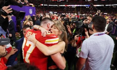 Travis Kelce of Kansas City Chiefs and Taylor Swift embrace after defeating the San Francisco 49ers in overtime during Super Bowl LVIII.