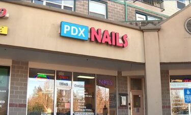 A woman is suing a Portland-area nail salon after she says she got infected with herpes.