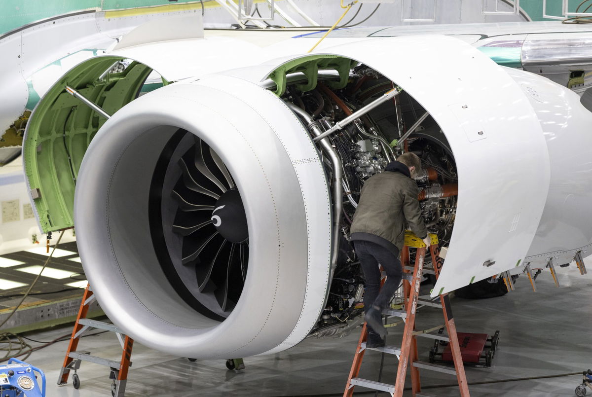 <i>Ellen M. Banner/Pool/The Seattle Times/AP via CNN Newsource</i><br/>A Boeing employee works on the engine of a 737 MAX on the final assembly line at Boeing's Renton plant. The Federal Aviation Administration has flagged more safety issues for two troubled families of Boeing planes.