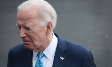 President Joe Biden answers questions while departing the White House on January 30