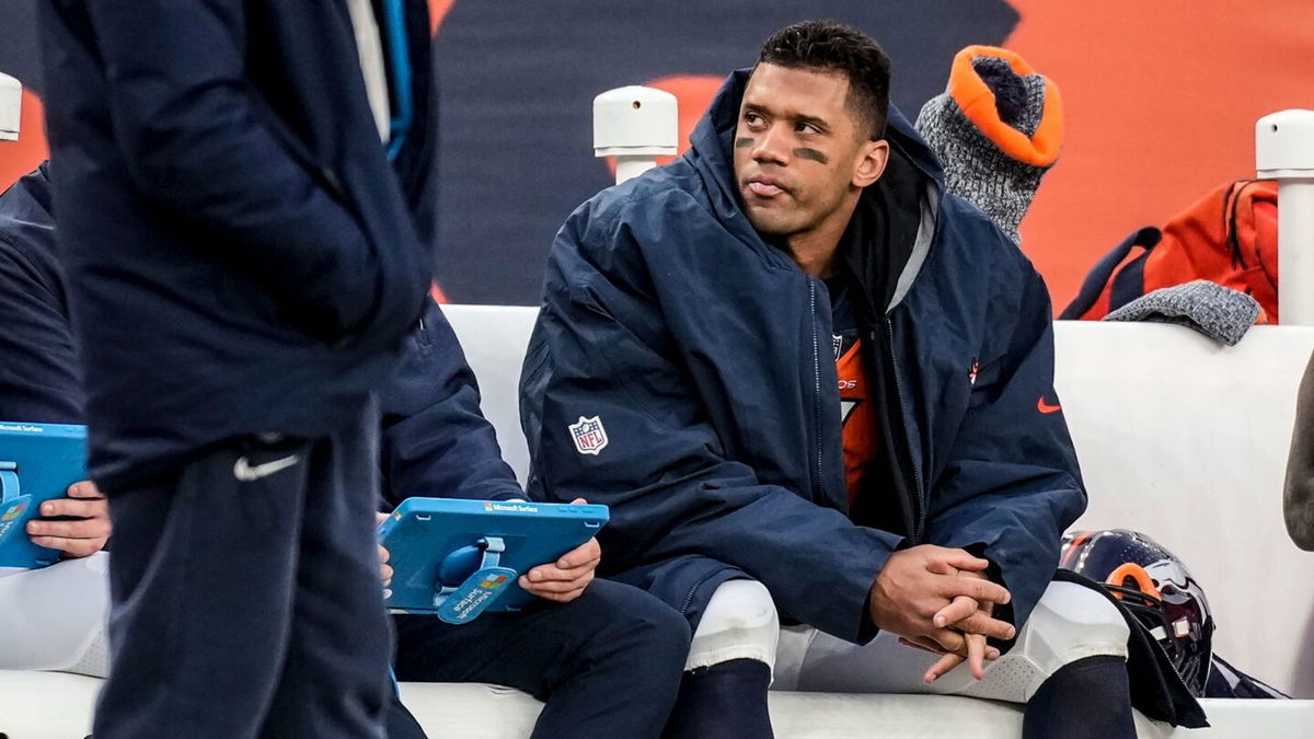 <i>David Zalubowski/AP via CNN Newsource</i><br/>Russell Wilson sits on the Broncos bench during the second half of a Week 17 game against the Los Angeles Chargers in December 2023. Wilson’s short and disappointing stay in Denver will come to an end when the Broncos release the 35-year-old quarterback March 13 at the start of the NFL year