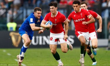 Rees-Zammit makes a tackle while playing for Gloucester.