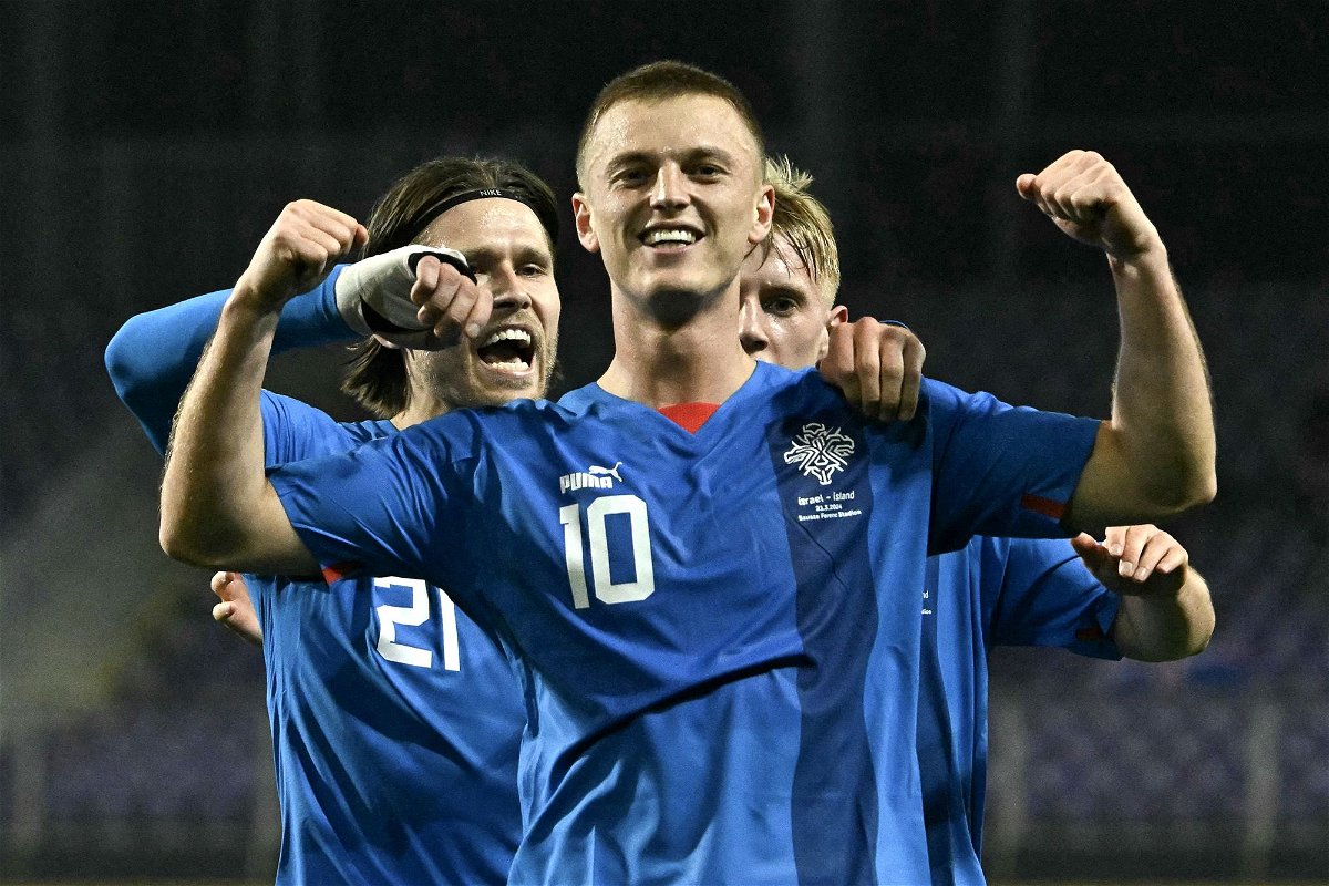 <i>Attila Kisbenedek/AFP/Getty Images via CNN Newsource</i><br/>Albert Guðmundsson celebrates after scoring for Iceland.