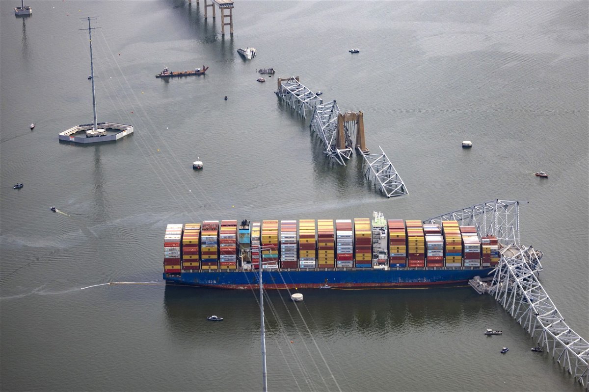 <i>Scott Olson/Getty Images via CNN Newsource</i><br/>Workers continue to investigate and search for victims after the cargo ship Dali collided with the Francis Scott Key Bridge causing it to collapse yesterday