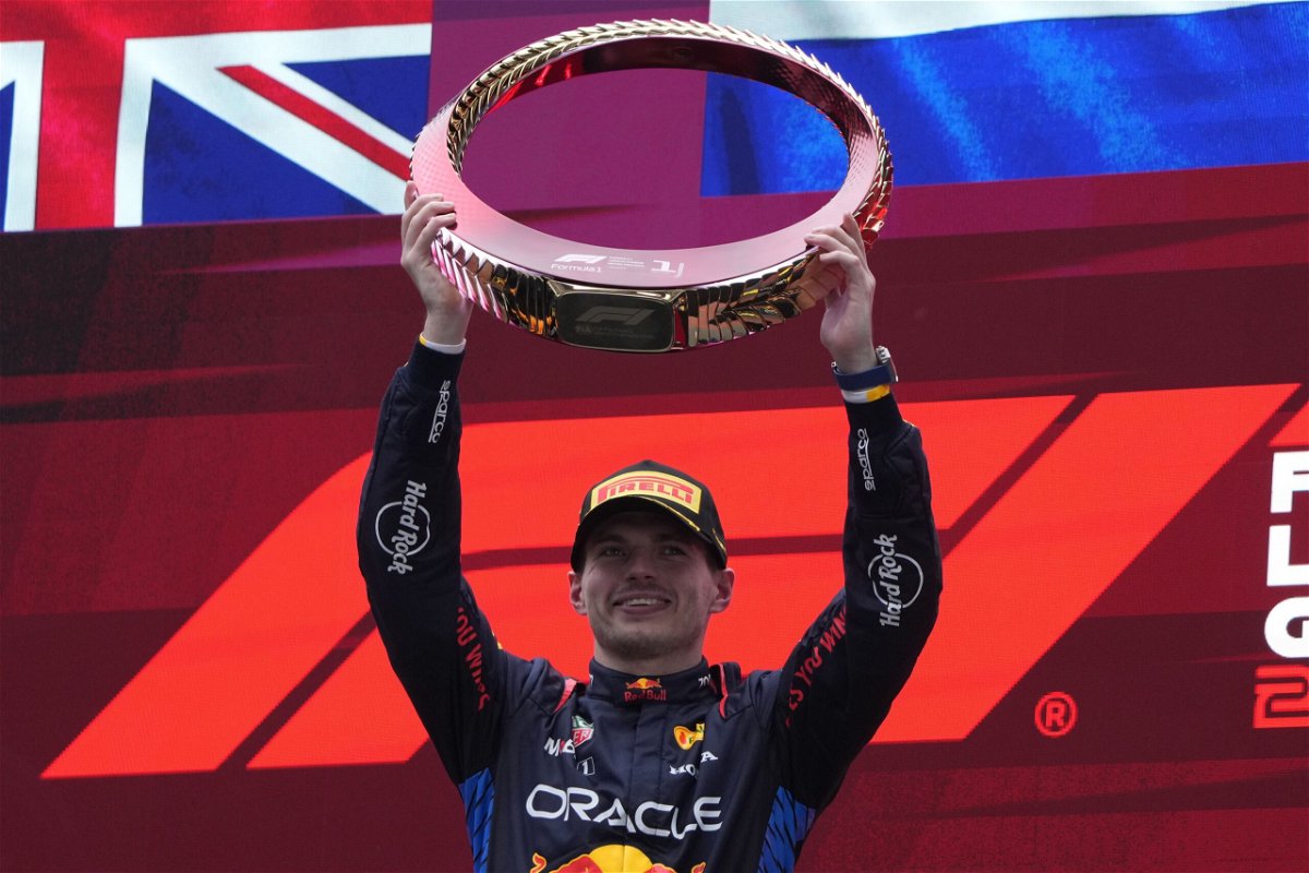 <i>Andy Wong/AP via CNN Newsource</i><br/>Red Bull driver Max Verstappen celebrates on the podium after winning the Chinese Grand Prix.
