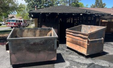 An off-duty Aurora fire captain rescued a dog before crews extinguished a burning carport in Aurora