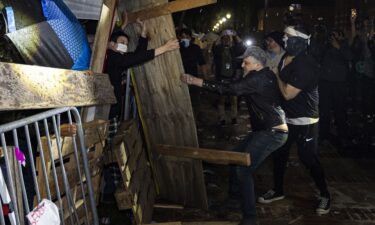 Counterprotesters attack a pro-Palestinian encampment set up on the campus of the University of California Los Angeles on May 1