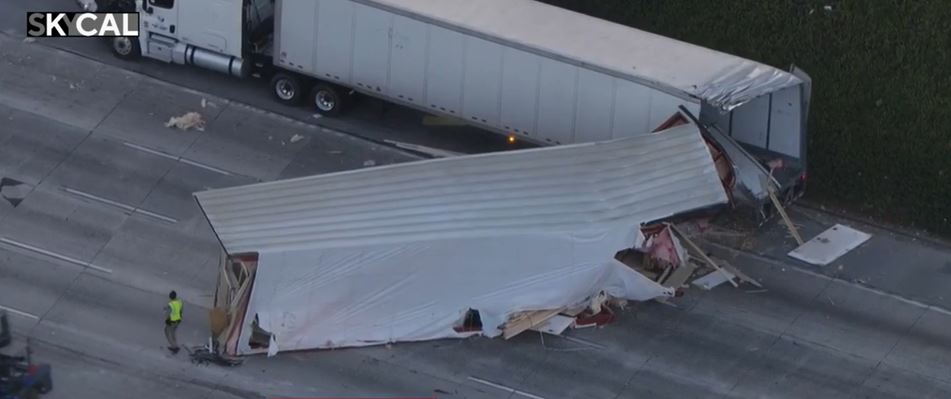 <i>KCAL via CNN Newsource</i><br/>The westbound 210 Freeway in Pasadena reopened on June 25 after several lanes were closed due to a crash caused by a manufactured home toppling off a big rig and colliding with another truck on the highway.