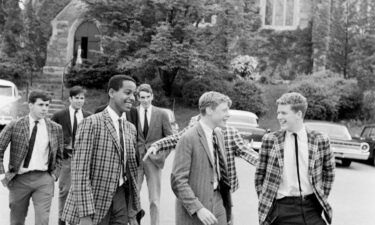 Students in madras blazers walk around the Milton Academy campus in Milton