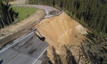 Cracks in the roadway on Teton Pass are seen on Friday