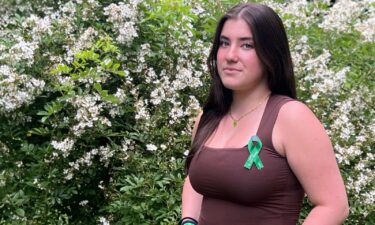 Newtown High's Class of 2024 will wear green and white ribbons on their graduation gowsn to remember those they lost.