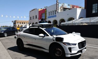 A Waymo autonomous self-driving Jaguar taxi drives near Venice Beach on March 14