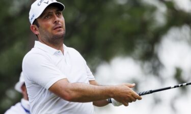 Francesco Molinari hits out of the rough to the eighth green during the second round.