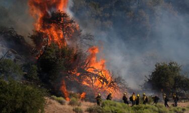 Firefighters respond to the Post Fire as it burns through the Hungry Valley State Vehicular Recreation Area in Lebec