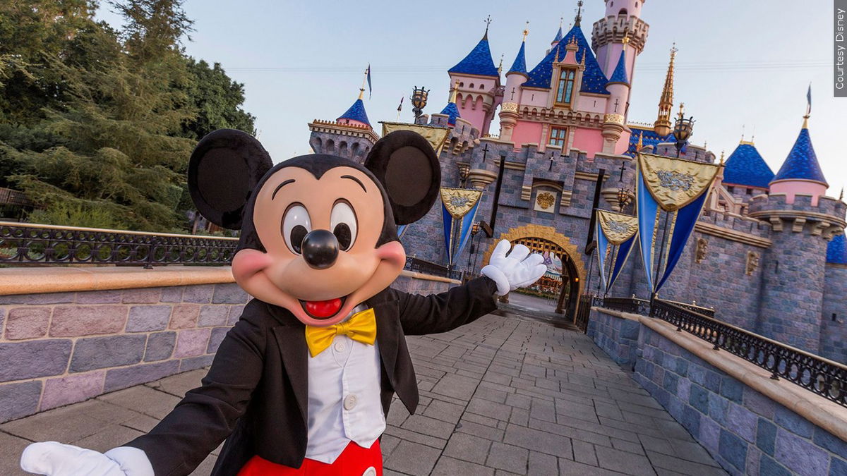 PHOTO: Mickey Mouse poses in front of Sleeping Beauty’s Castle at Disneyland Park in Anaheim, Calif, Photo Date: 2024