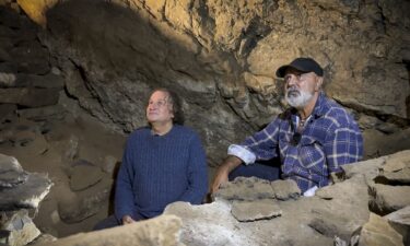 Professor Bruno David (L) and Uncle Russell Mullett (R) pictured in the cave.