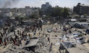 Palestinians inspect the damage at a site hit by an Israeli bombardment on Khan Younis on Saturday.