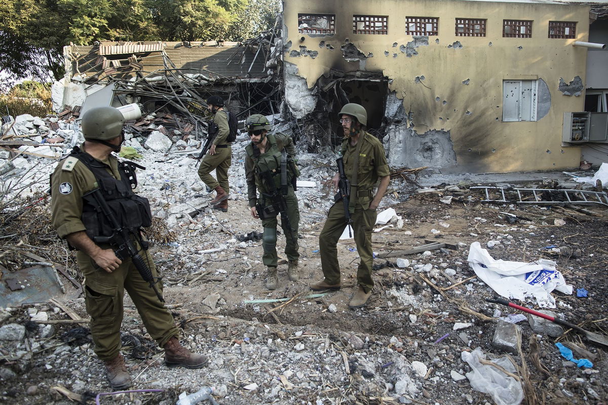 <i>Leon Neal/Getty Images via CNN Newsource</i><br/>Photographs of some of those taken hostage by Hamas during the October 7 attack on Israel are seen in Tel Aviv