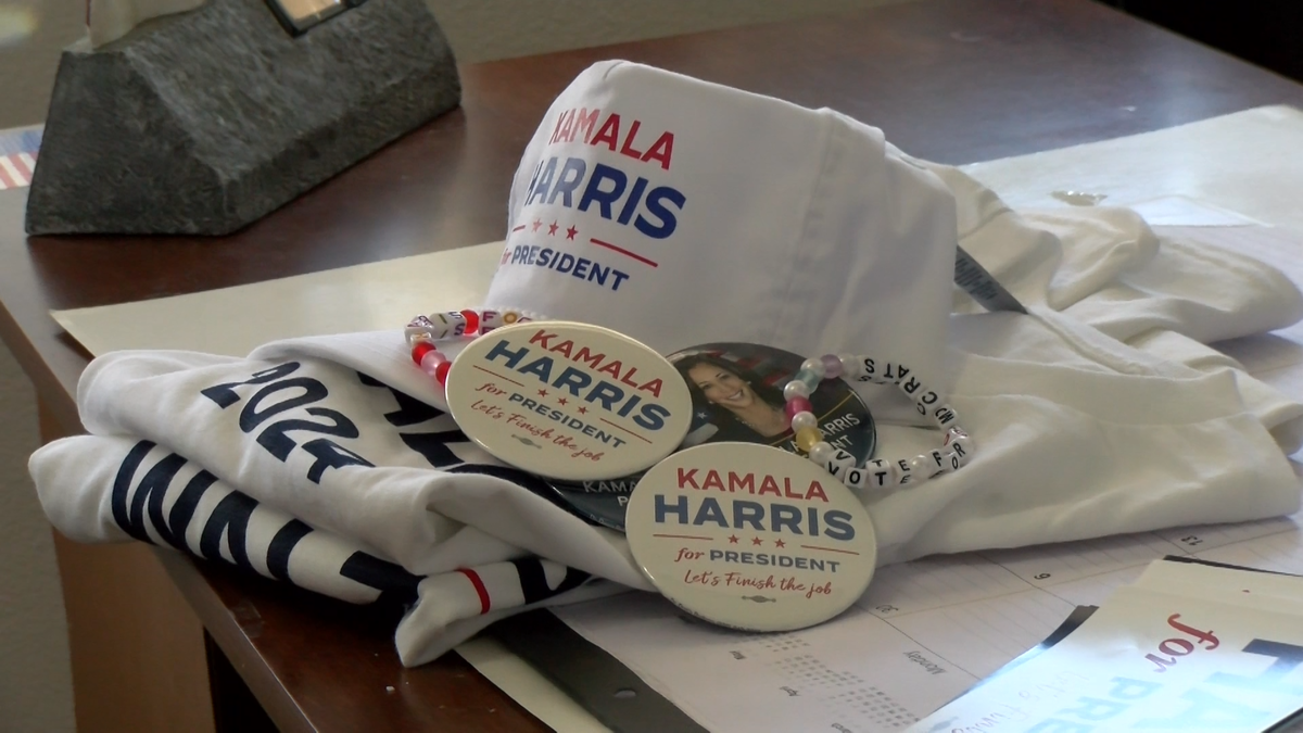 Merchandise emblazoned with "Kamala Harris for President" lays on a table at the Democratic Headquarters of the Desert