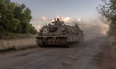 Ukrainian servicemen operate an armored military vehicle in the Sumy region near the border with Russia on August 12.