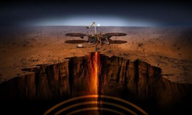 An artist's concept shows a cutaway of Mars along with the paths of seismic waves from two separate quakes detected by InSight in 2021.