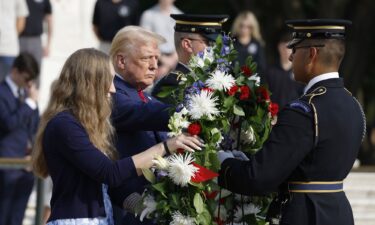 Former U.S. President Donald Trump stands alongside Misty Fuoco